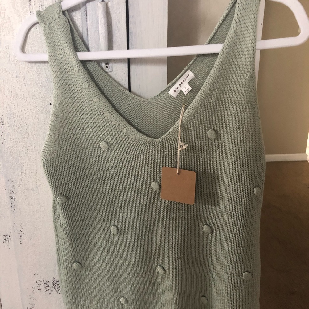 Knit creamy green tank top. Never warn
